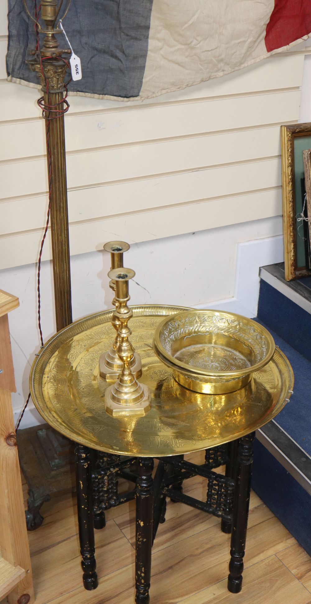 A corinthian column standard lamp, height 132cm, a pair of candlesticks and Benares table and two Eastern brass bowls